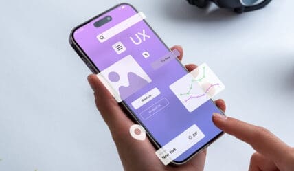 Person holding a mobile phone with UX Design elements